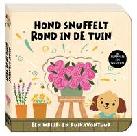 Hond snuffelt rond in de tuin
